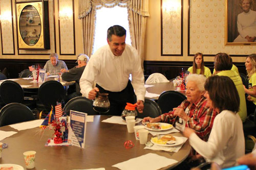 Nevada Governor Brian Sandoval serves up pancakes at last year's event.