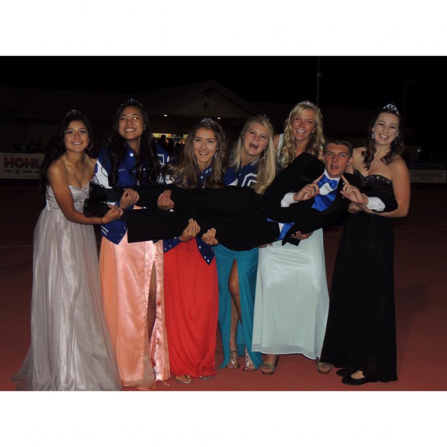 The beautiful Homecoming candidates and very lucky Kyle Kunz in the center.