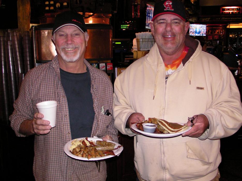 John Davis, left, and Alan Gleissner prepare to eat.