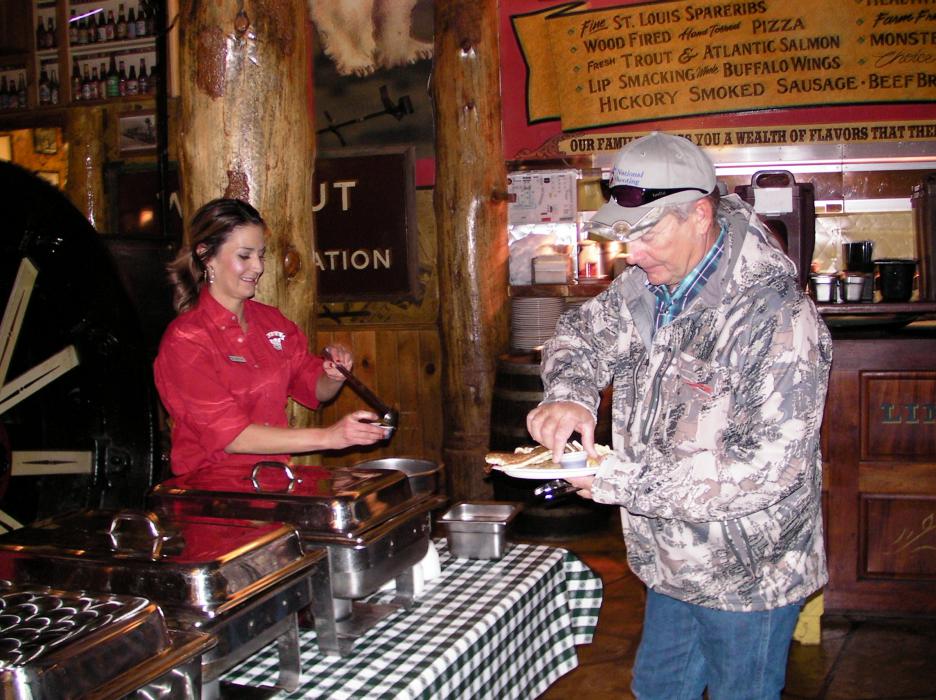 Jeff Dinsmore loads up with pancakes. Dinsmore was with his wife Mary of Western Title and Dinsmore Excavating.