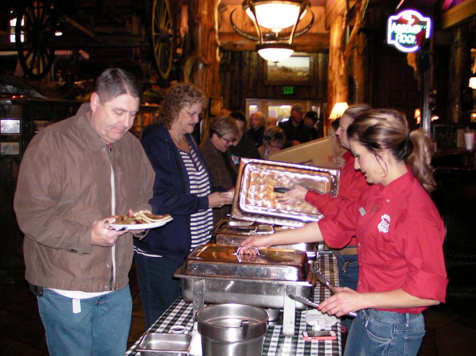 Hungry guests line up at Red's Old 395 Saturday for BAWN's annual pancake breakfast.