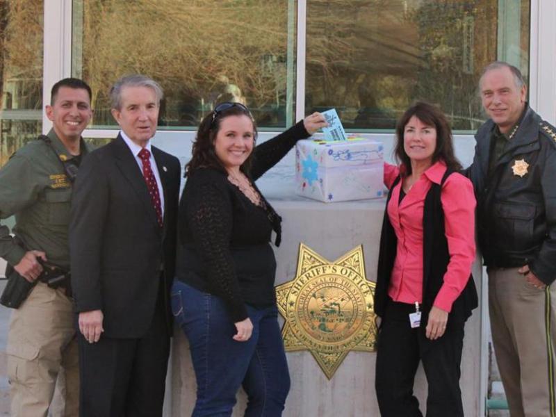 Sgt. Daniel Gonzales, Mayor Bob Crowell, Renee Taylor Plain, Peggy Sweatland and Sheriff Ken Furlong.