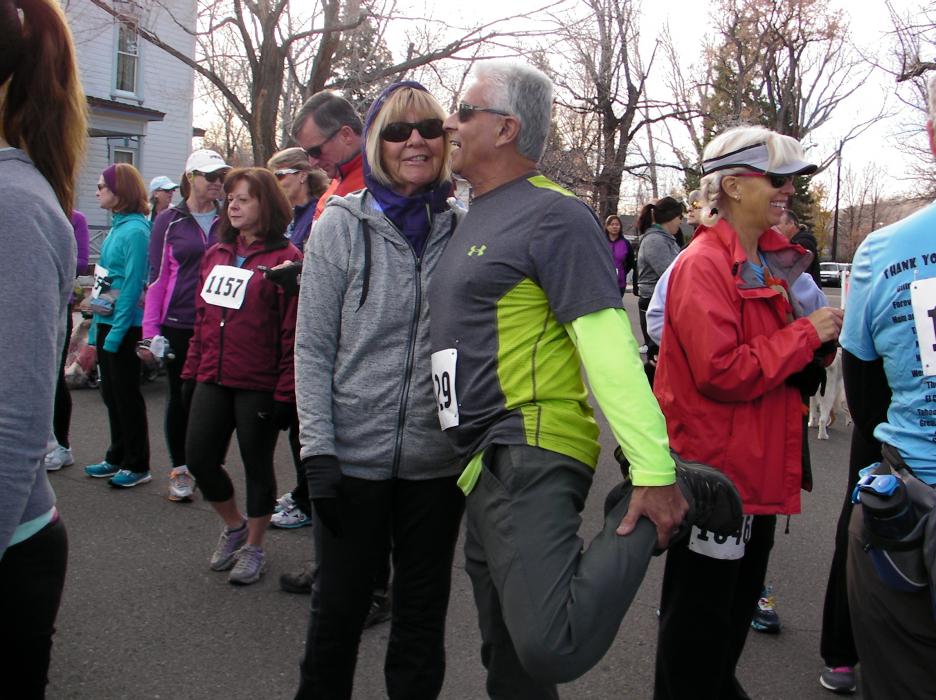 Danny Andrade stretches ahead of the race with wife Pam.