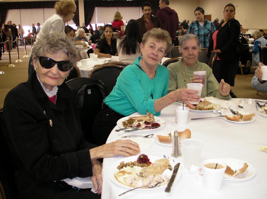 Lori Hogan and Nina Spradlin tie one on with coffee, tea and good cheer.
