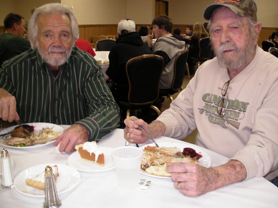Michael Fodays and Virgil Cameron enjoy the meal.