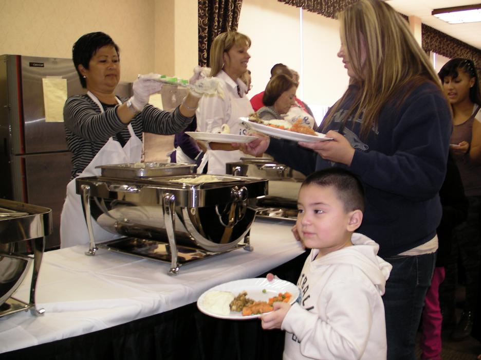 Cesar Duarte, 3, fills up his plate Thursday at the 60th Carson Nugget Thanksgiving Dinner in Carson City.