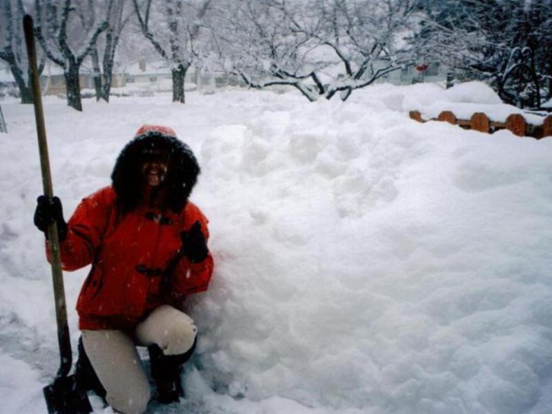 Elaine Quilici taking a break from shoveling that deep snow. Photo by Don Quilici