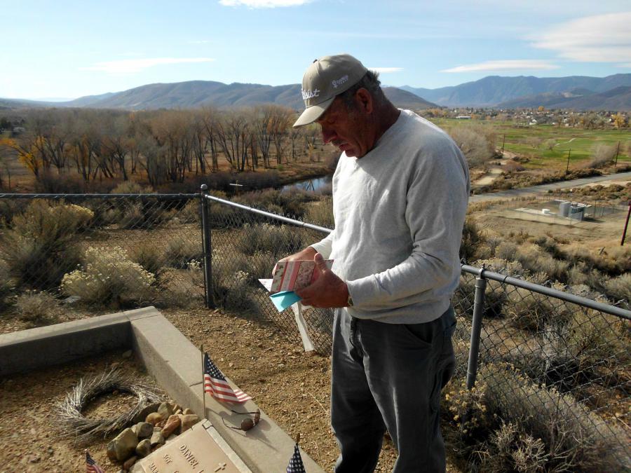 John's cousin Jim Warne from Carson City reading a card left at Danny's gravesite.