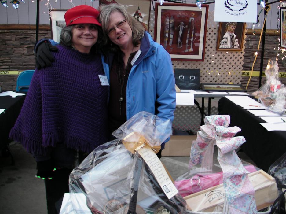 Robin McGregor and volunteer Leigh Lunt at the silent auction booth.