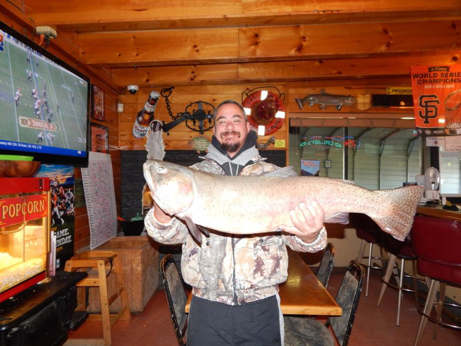 Travis Williams of Reno with his 18 lb, 5.6oz, 34.25 inch Cutthroat Trout caught at Pyramid Lake. Photo by Crosby Lodge