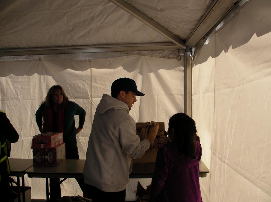 Chris Graham, internship coordinator for Western Nevada College, helps prepare refreshments for the kids.