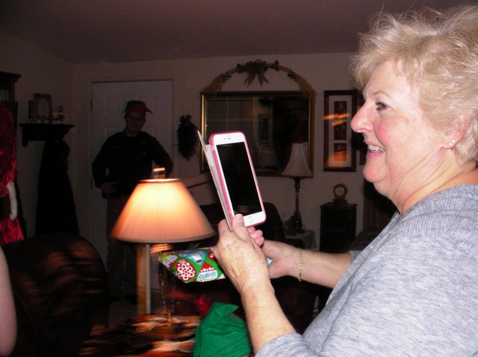 Janis Schomaker captures video of the moment she organized as a surprise to her children and grandchildren.