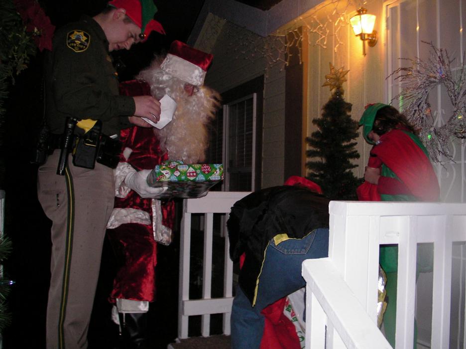Santa and his helpers prepare to enter the Schomaker residence.