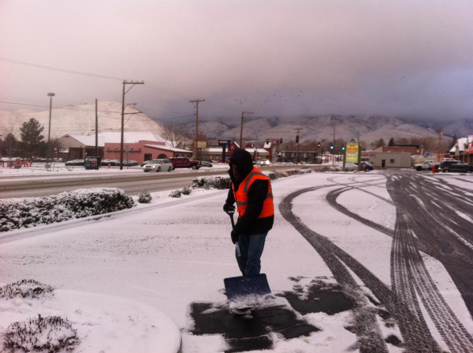 Traver McQueary shovels snow across from Tito's on William Street.