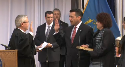 Gov. Sandoval is joined by First Lady Kathleen Sandoval in being sworn into his second term as Nevada governor.
