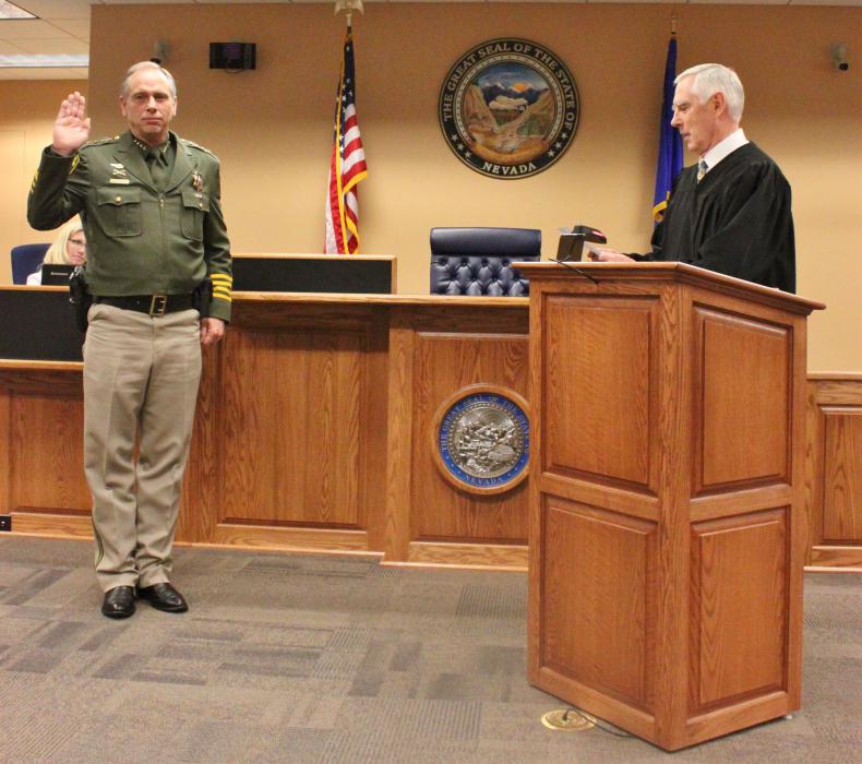 Carson City Sheriff Ken Furlong swears in for a fourth term by District Court Judge James T. Russell.