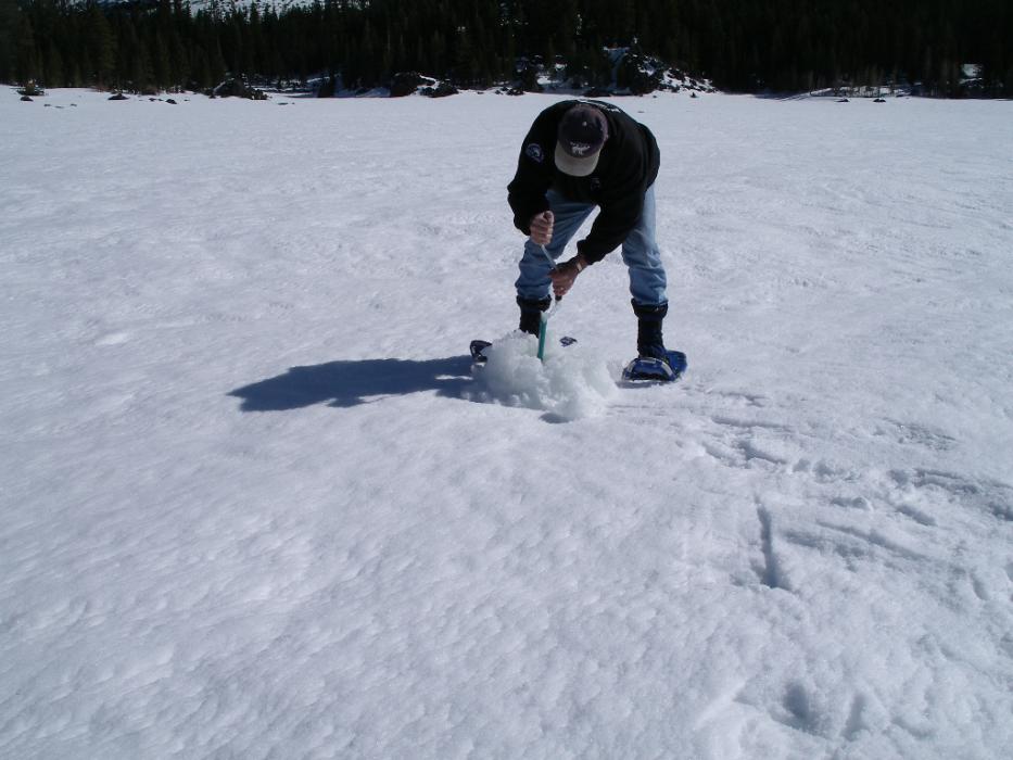 Almost through the thick ice.  File photo courtesy of Don Quilici
