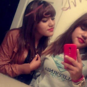 The photo of Saurem shows her with her identical twin.