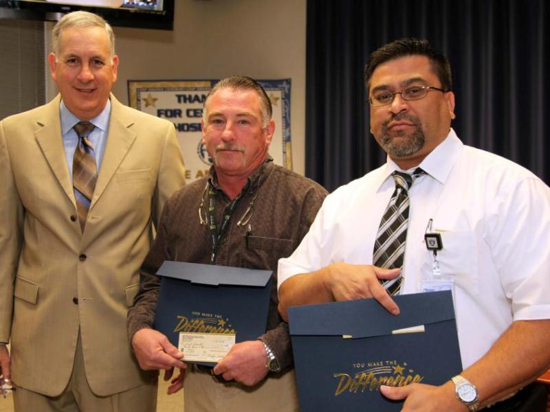NDOT Assistant Director of Engineering John Terry (left) presents award to Kurt Garret (center) and Oscar Fuentes.