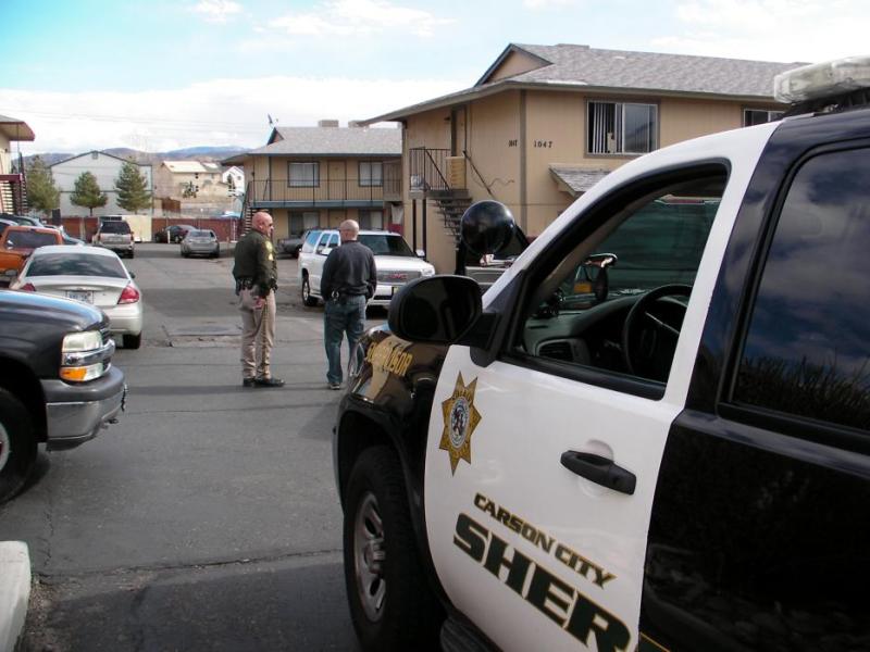 Sgt. Mike Cullen talks with Lt. Brian Humphrey following a robbery Saturday at a Carson City apartment complex.
