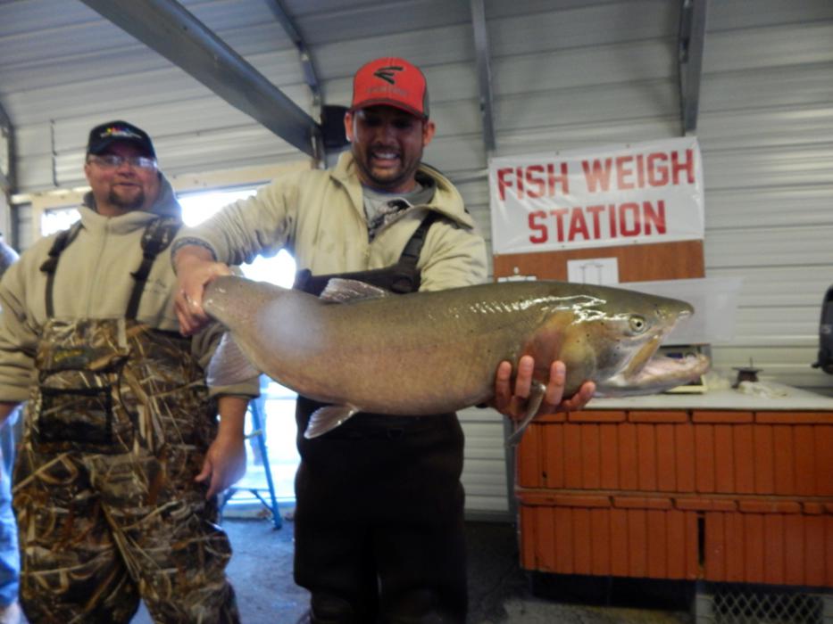 Travis Lee of Sparks with his 20 pound, 8.8 ounce, 35 inch Cutthroat Trout  caught from shore at Pyramid Lake.
