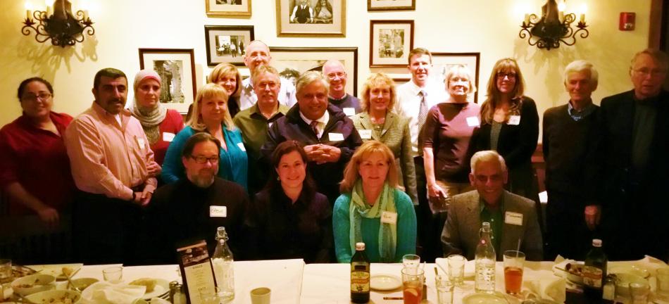 Some of the “Faith Forum” panelists, their spouses and others at a recent dinner celebrating the completion of 200th column.