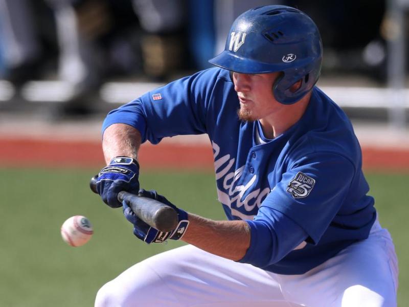 Jake Bennett bunts against the College of Southern Idaho in Wednesday's opener. Photo by Cathleen Allison, Nevada Photo Source