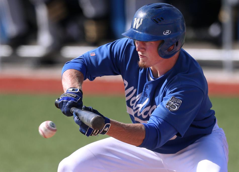 Jake Bennett bunts against the College of Southern Idaho in Wednesday's opener. Photo by Cathleen Allison, Nevada Photo Source