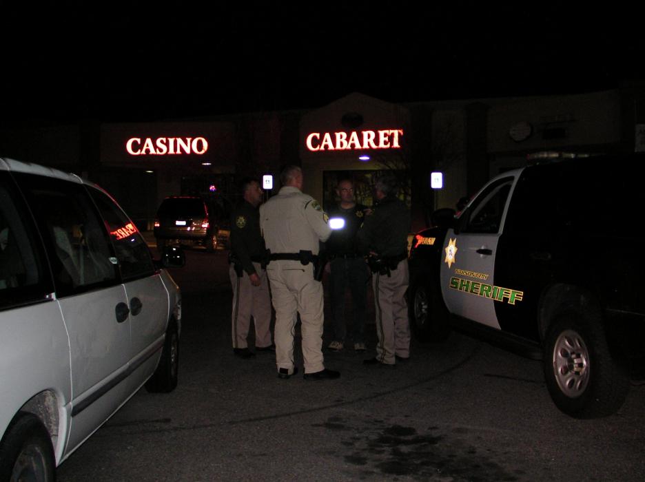 Officers investigate an armed robbery at Slotworld's Cabaret on Winnie Lane in Carson City. 