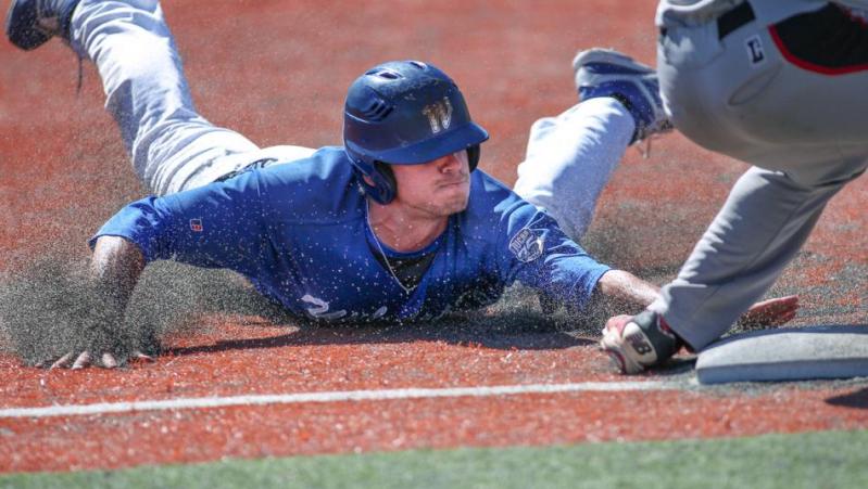 Wildcats' DJ Peters steals third base against Colorado Northwestern CC at WNC in Carson City. Photo by Cathleen Allison