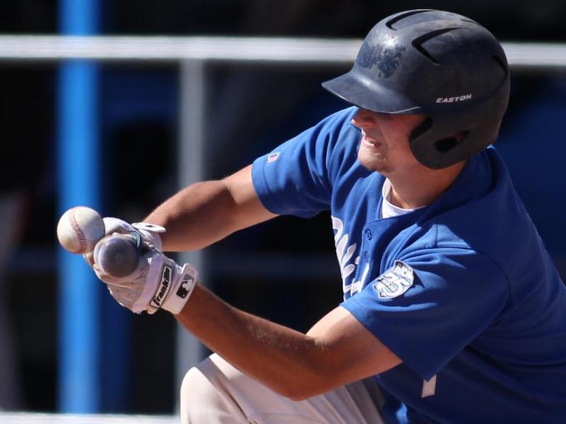 Wildcats' Tim Lichty attempts to bunt against Colorado Northwestern Friday at WNC in Carson City. Photo by Cathleen Allison