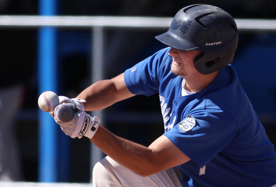 Wildcats' Tim Lichty attempts to bunt against Colorado Northwestern Friday at WNC in Carson City. Photo by Cathleen Allison