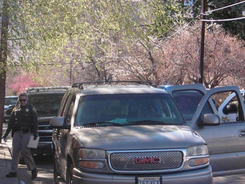 Deputy Jessica Chrzanowski prepares to inventory the stolen SUV.  Photo by Jeff Munson