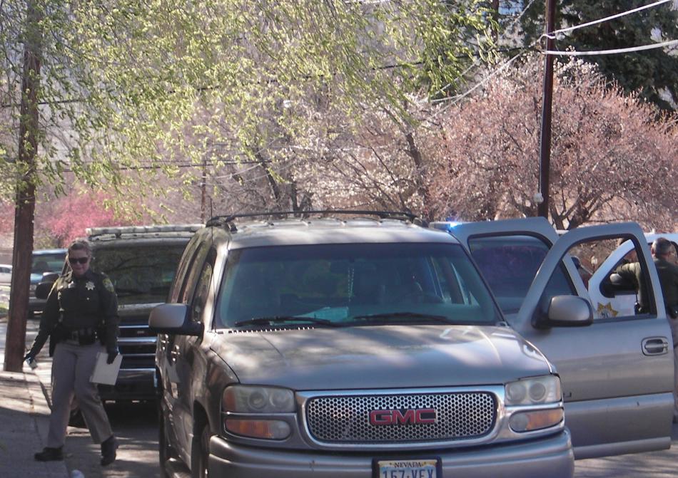 Deputy Jessica Chrzanowski prepares to inventory the stolen SUV. Photo by Jeff Munson