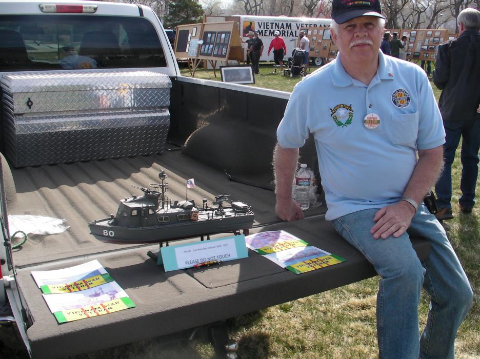Vietnam Veteran Don Bemis with a model PCF-80 swift boat, a replica of the one he was on during the war.