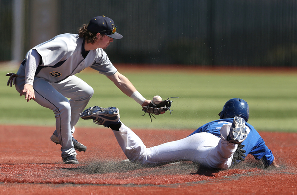 Wildcats' DJ Peters steals safely in this photo from Friday. Cathleen Allison, Nevada Photo Source