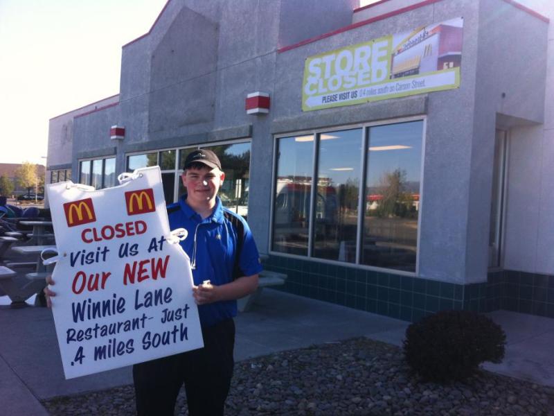 Cody Brooks holds a sign outside the former McDonald's location at 3344 North Carson Street in Carson City.