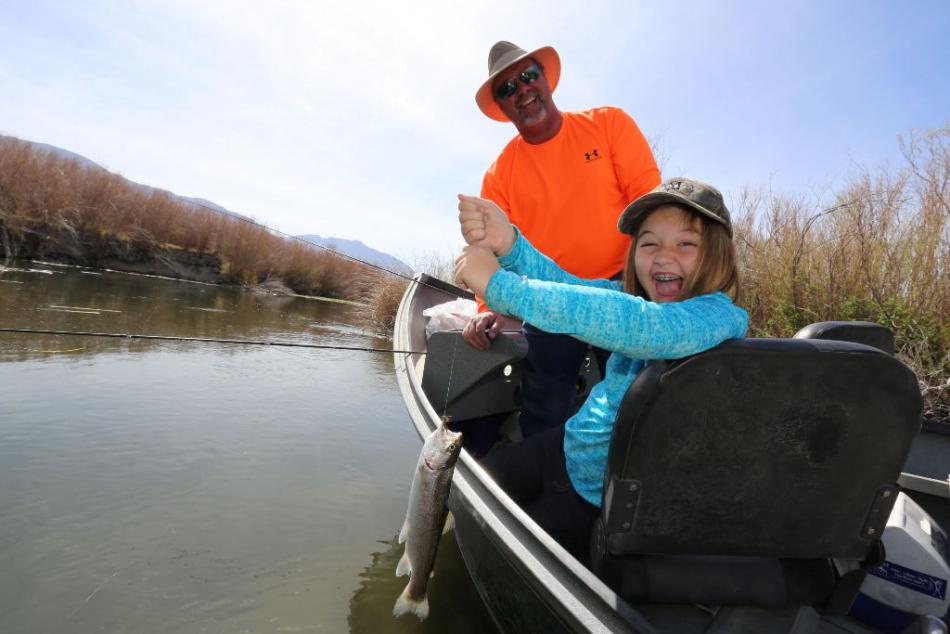 Happy angler with a first fish on a fly at Owens River, Calif.  Photo courtesy of Tom Loe of www.sierradrifters.com