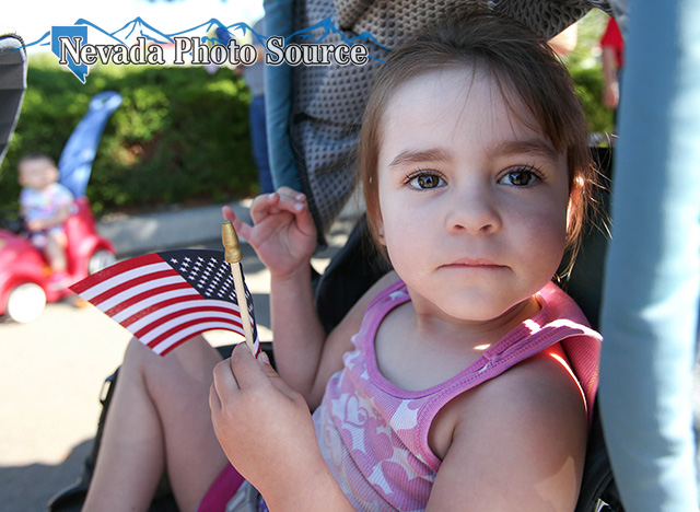 Larissa Nelson, 2, waits with her family for the start of the Veterans Suicide Awareness walk.