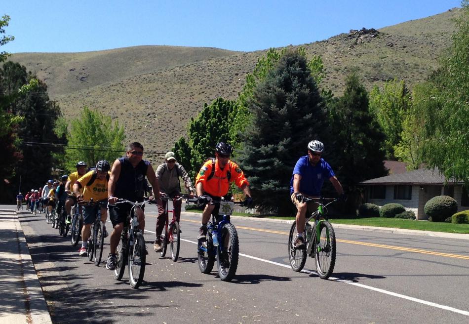 Jeff Moser (orange shirt) leads the ride down North Ormsby Boulevard.
