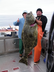 Elaine Quilici with her 148 pound Halibut at Sitka, Alaska.  Photo by Don Quilici