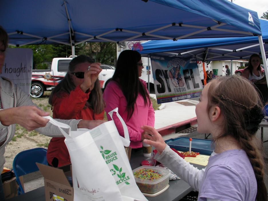 Ethne Myler, 10, visits the Food for Thought booth.