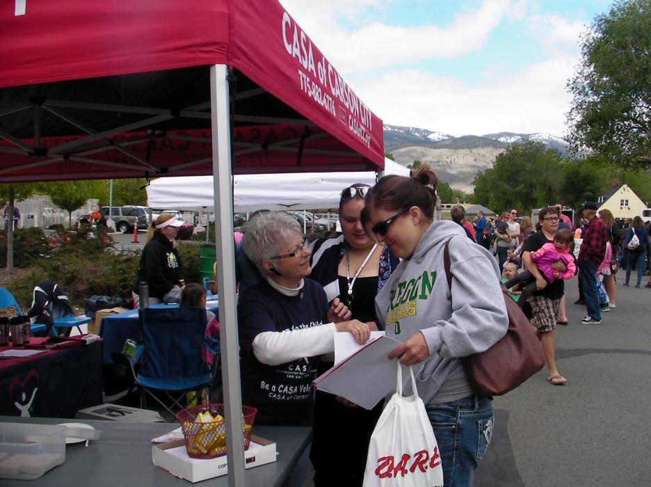 Jodee Brooks checks out the CASA booth with Suzanne Cameron.