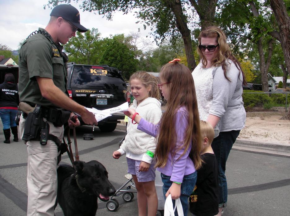 Deputy Sean Palamar of the K9 unit signs on for the kids.