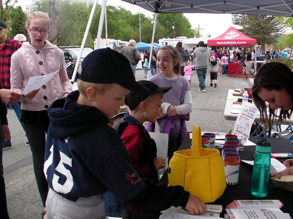 Asher and Cannon Myler, ages 5 and 7, at the Carson City Library booth.