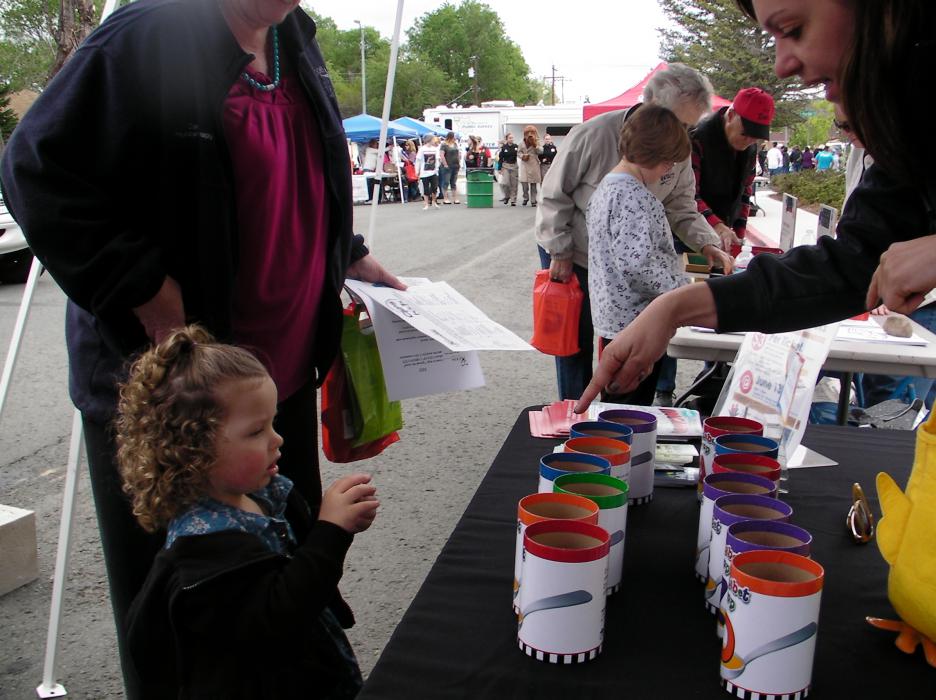 Rhiley Harper, 2, look at her choices in a game of pickup cups.