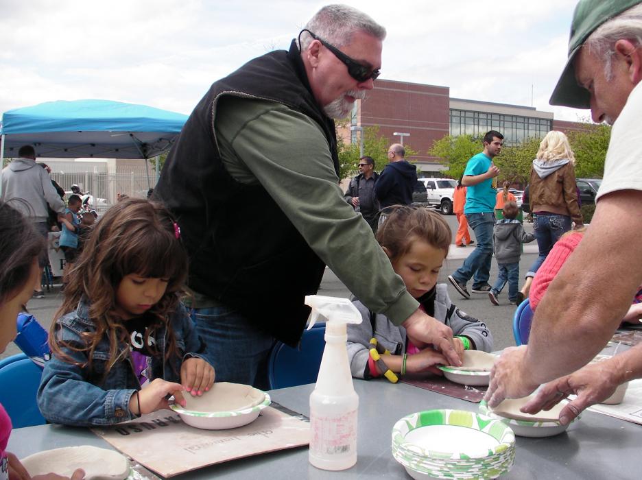 Zoe Shelton and Jasmine Slater prepare pottery for Carson City's Empty Bowls project.