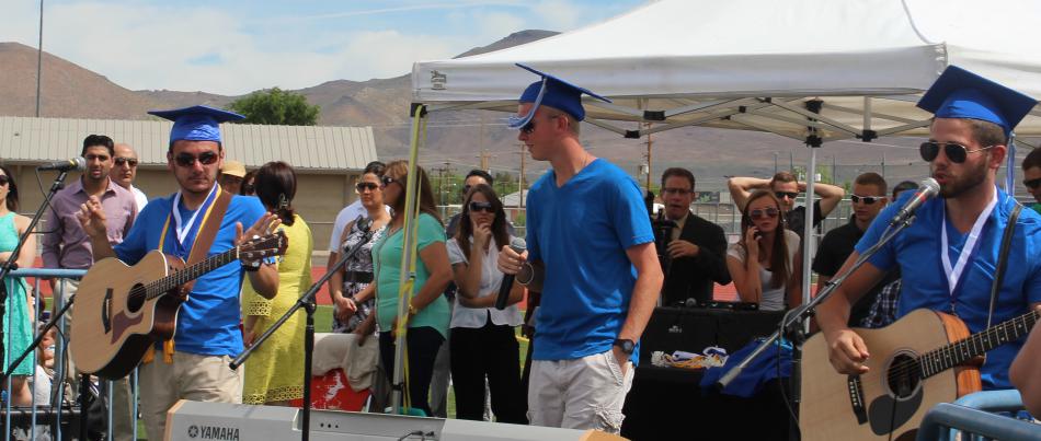 Carson High graduates, Brent Lauderbaugh, Daniel Cihigoyenetche, Chris Capshaw and Jake Jones perform the senior song.