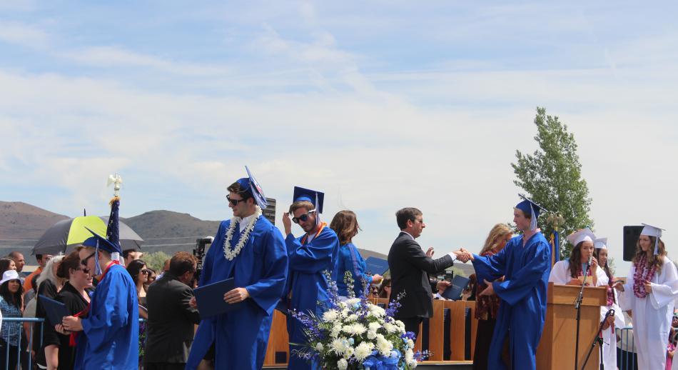 Students received their diplomas and shook hands with members of the Carson City school board.