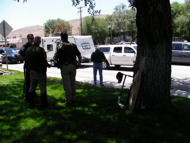 Carson City deputies and NHP officers at the scene of an accident involving a scooter.